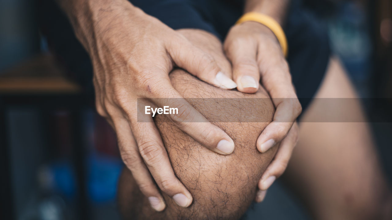 Close-up of man with knee ache