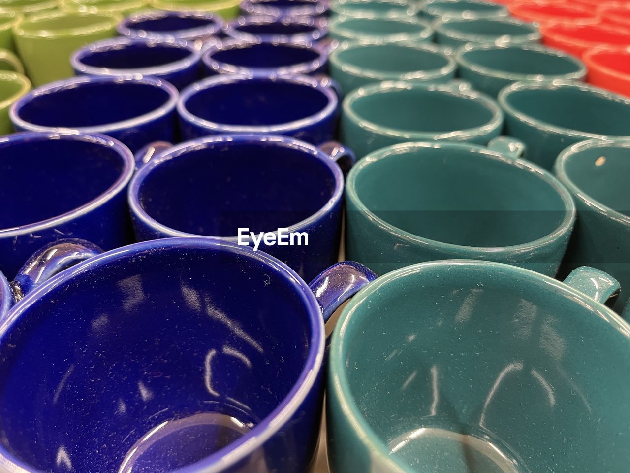 FULL FRAME SHOT OF BLUE PLASTIC CONTAINER IN ROW