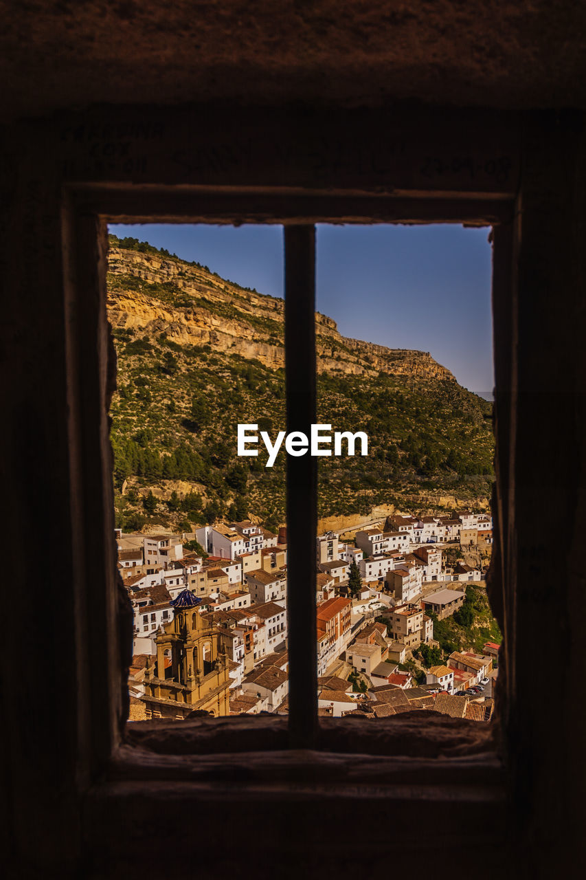 View of the villa de chulilla framed with a castle window