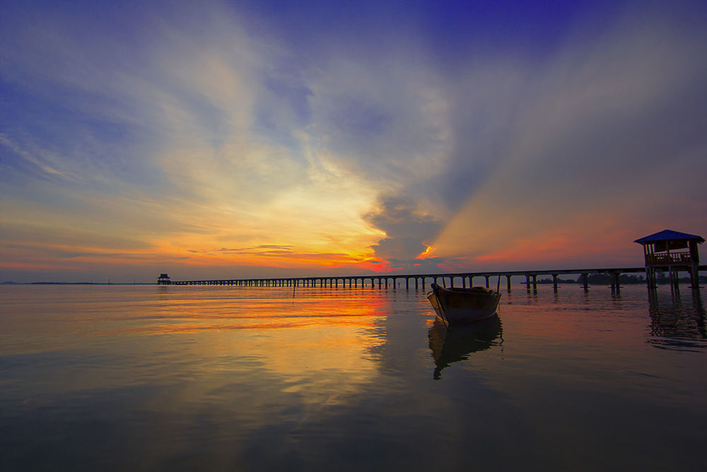 SCENIC VIEW OF SUNSET OVER SEA