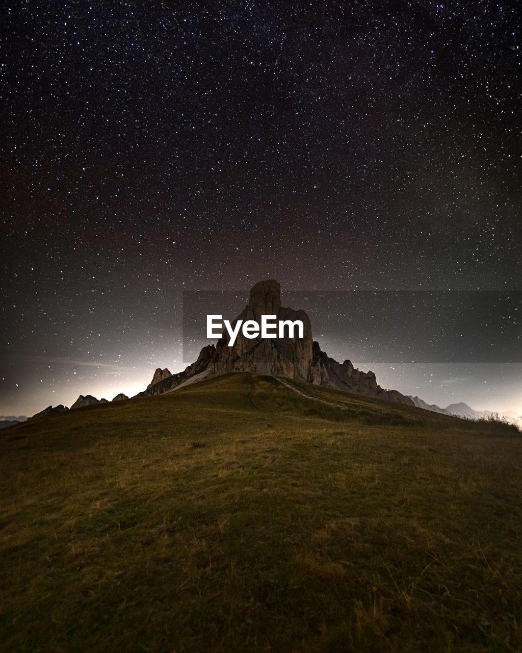 Scenic view of landscape against sky at night