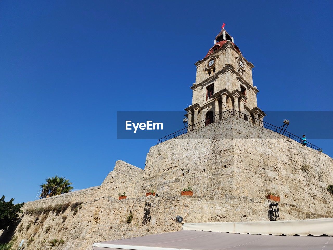 architecture, built structure, building exterior, sky, history, travel destinations, landmark, the past, blue, clear sky, tower, nature, travel, building, sunny, tourism, monument, religion, low angle view, day, place of worship, outdoors, historic site, belief, sunlight, spirituality, city, temple, ancient, no people, temple - building