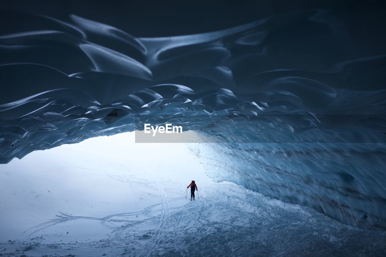 Person skiing in ice cave