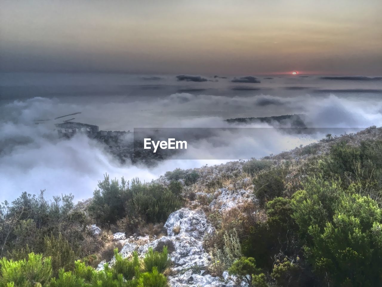 Aerial view of clouds over mountain