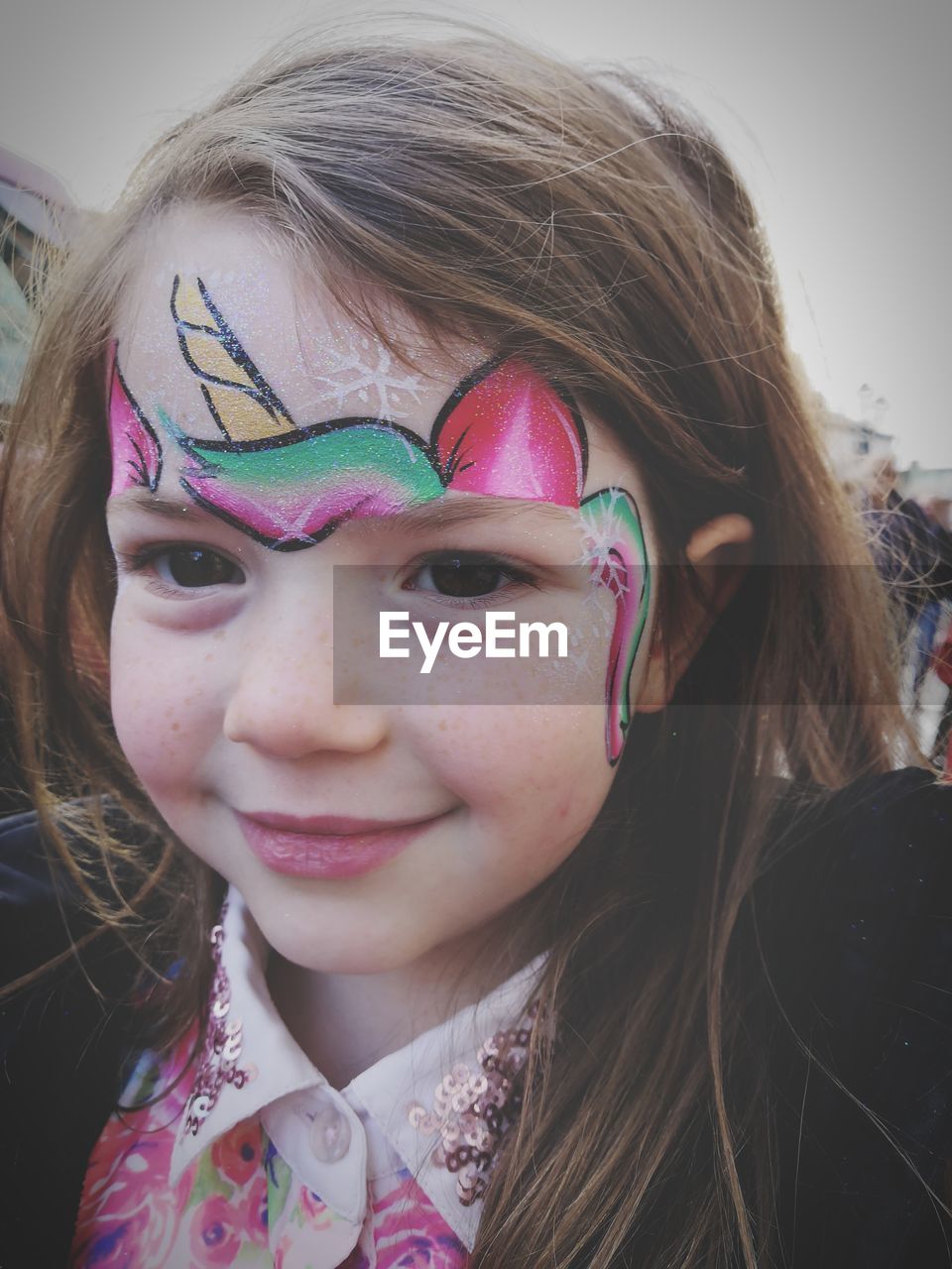 Close-up portrait of girl with face paint