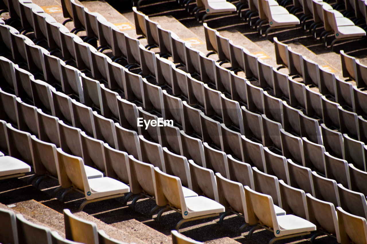 High angle view of empty chairs in stadium 