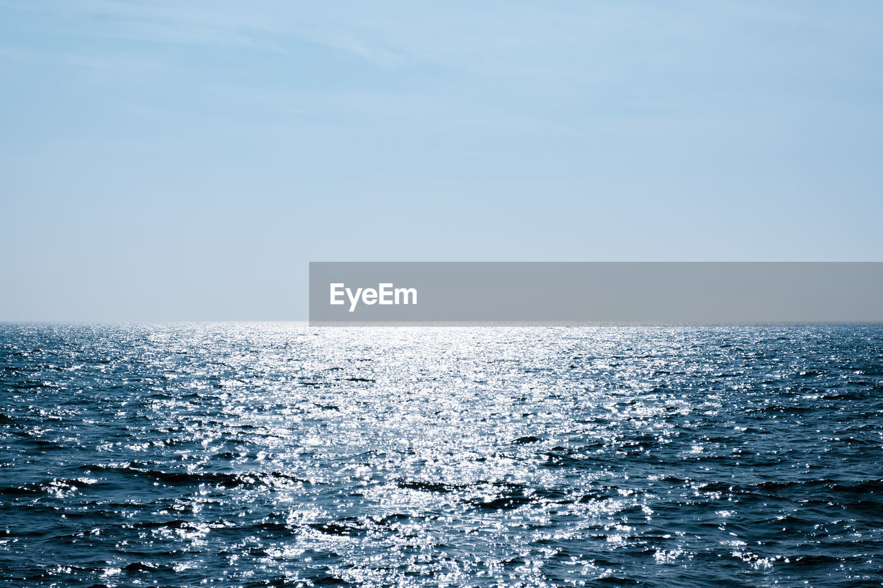 SCENIC VIEW OF SEASCAPE AGAINST CLEAR SKY