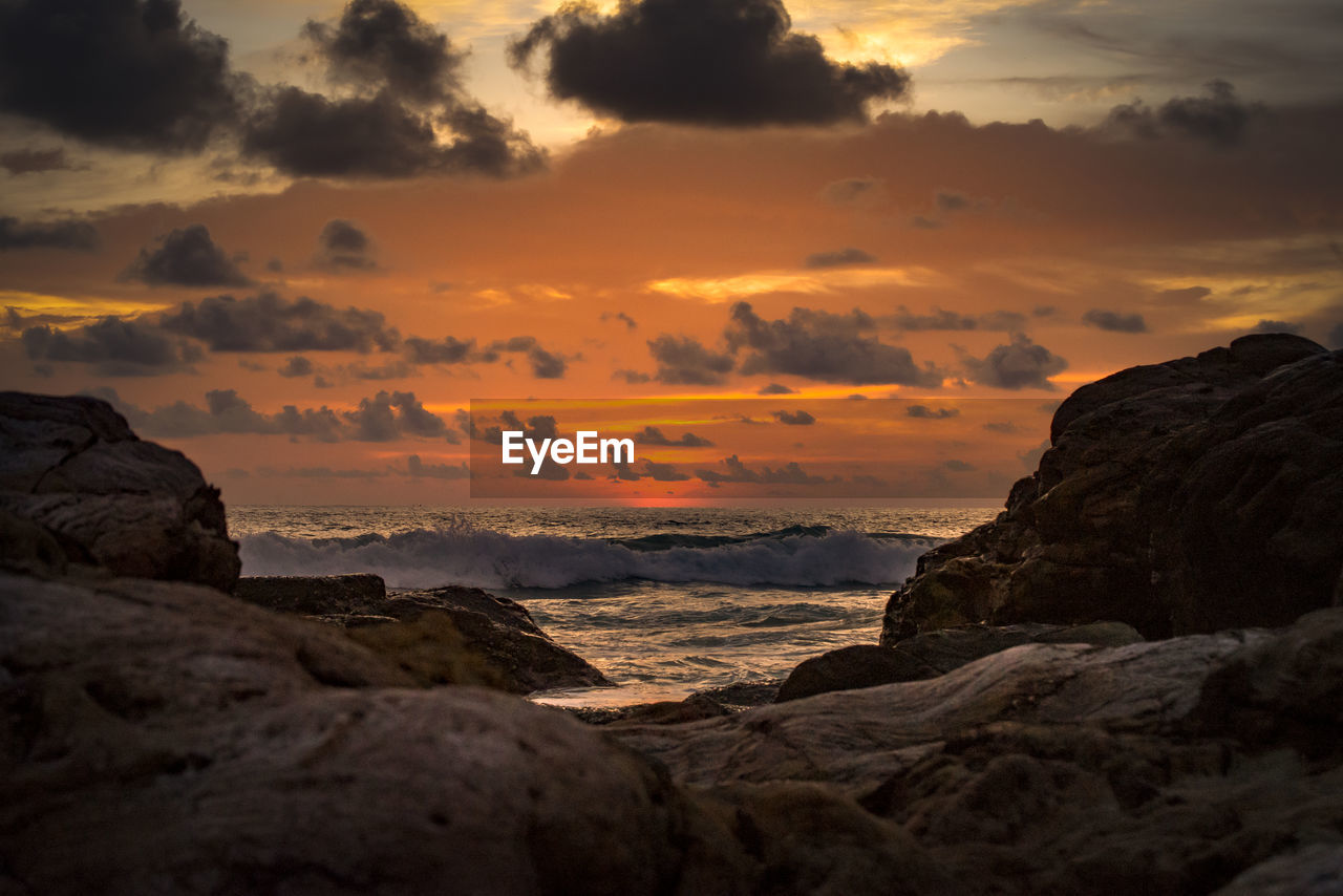 Scenic view of sea against sky at sunset