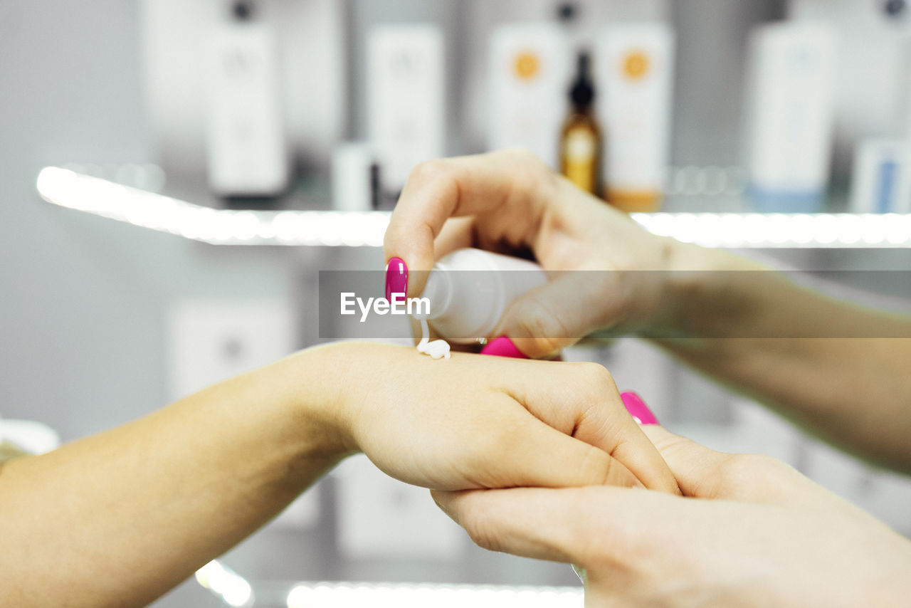 cropped hand of person washing hands in hospital