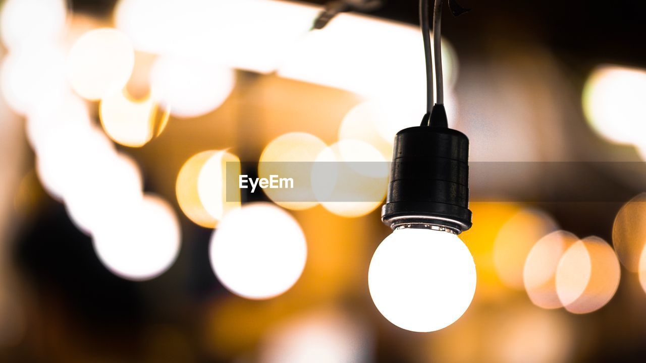 Close-up of illuminated light bulb