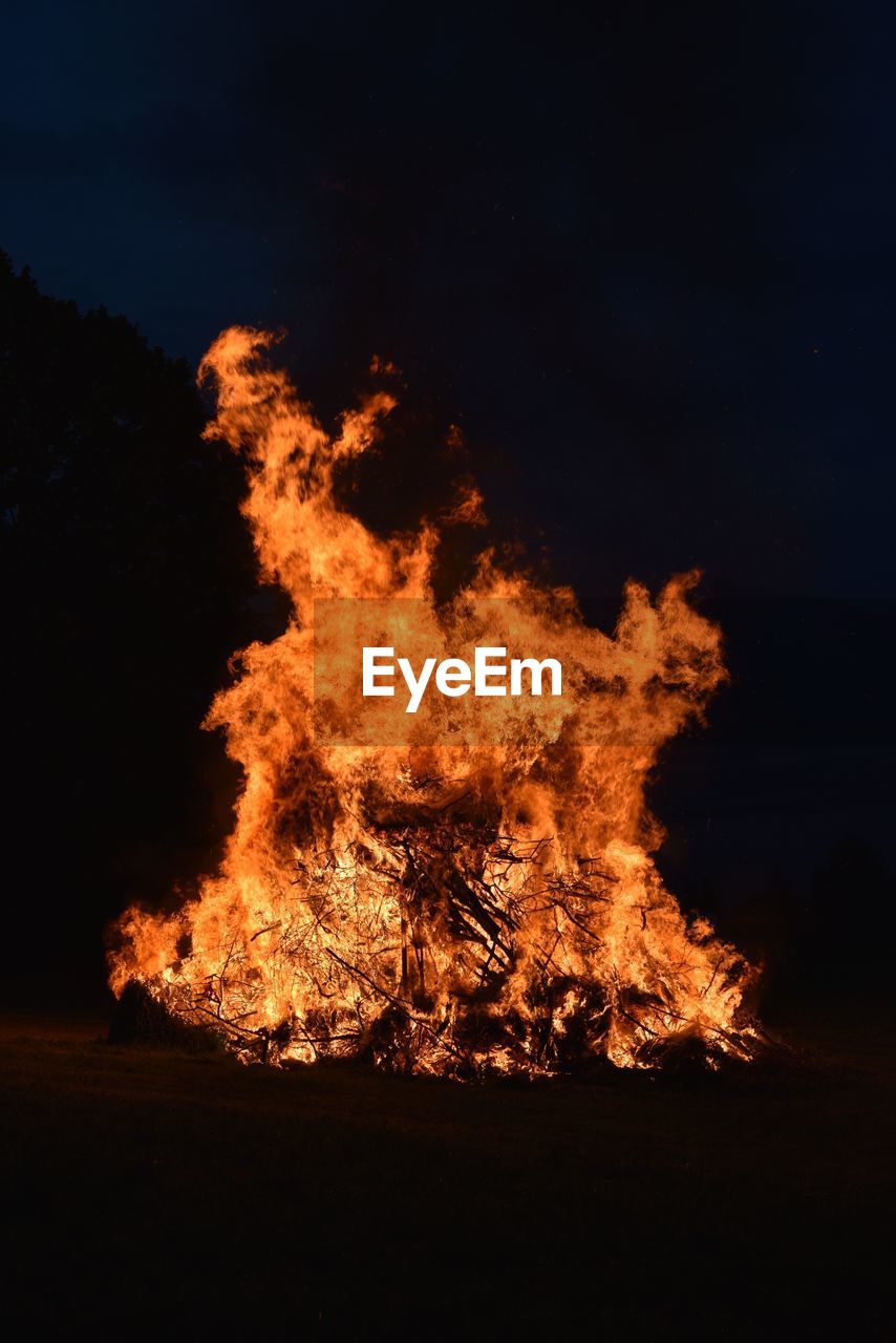 View of bonfire against sky at night