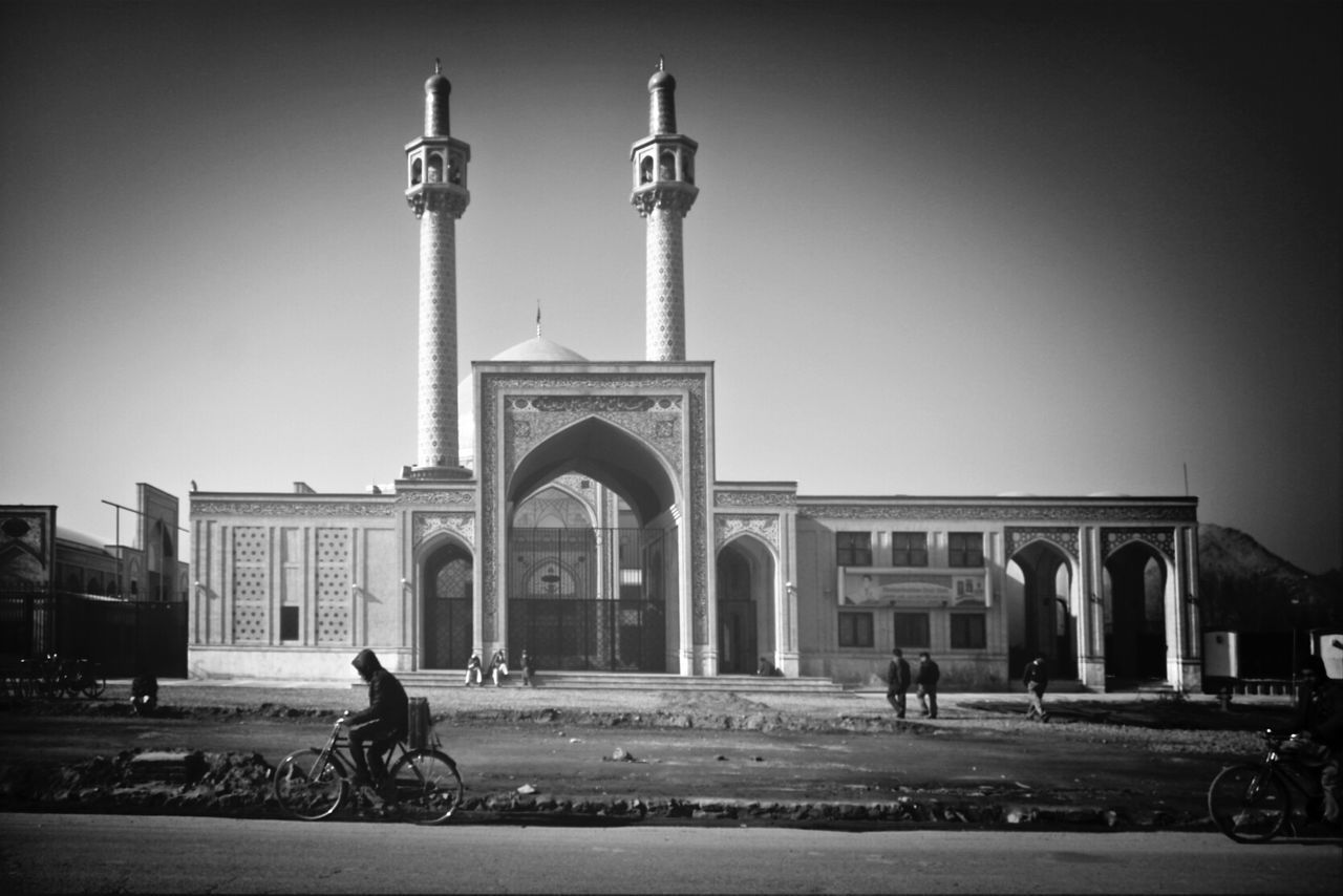 Low angle view of mosque against clear sky in city