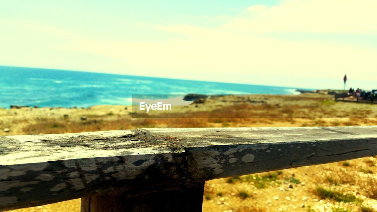 CLOSE-UP OF WOOD AGAINST SKY