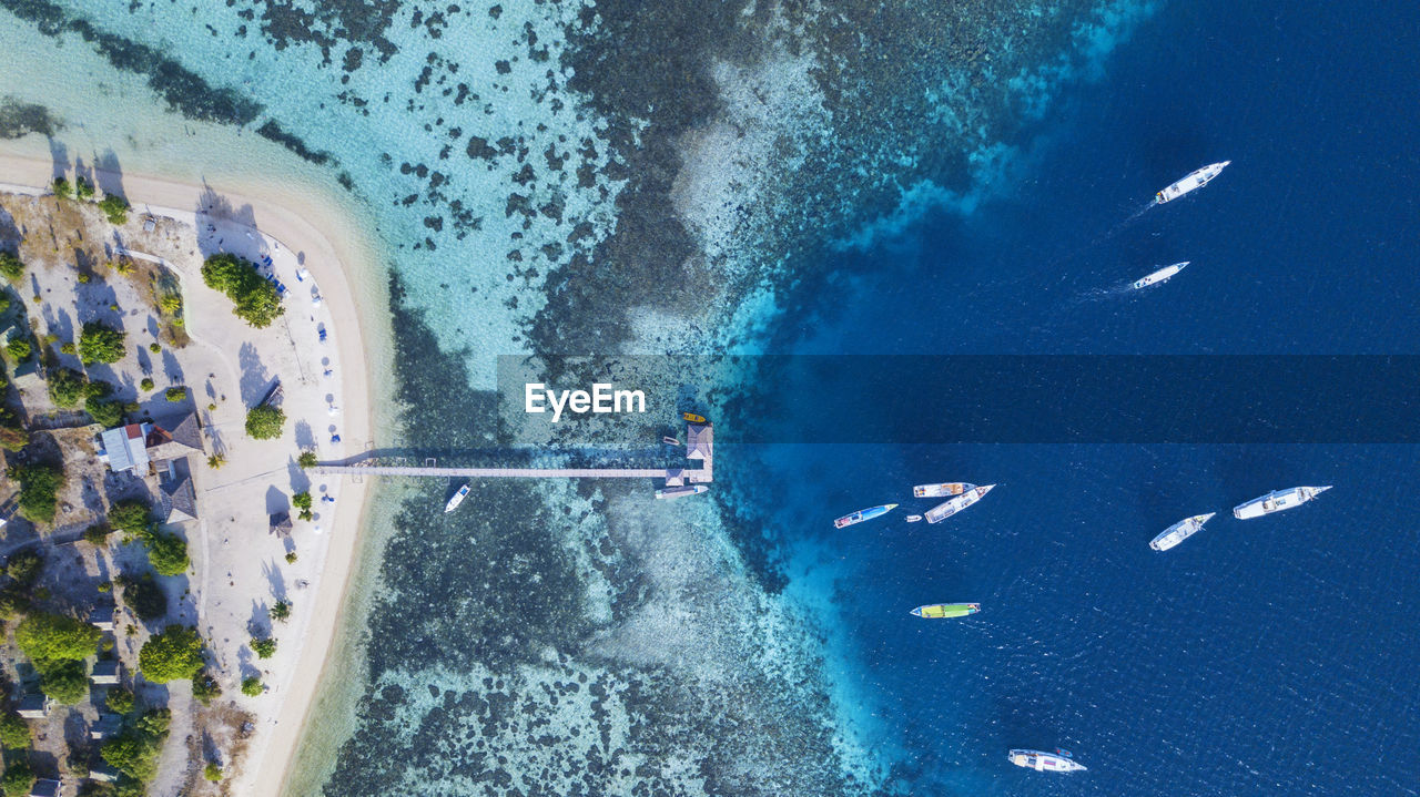 Aerial view of boats moored at harbor