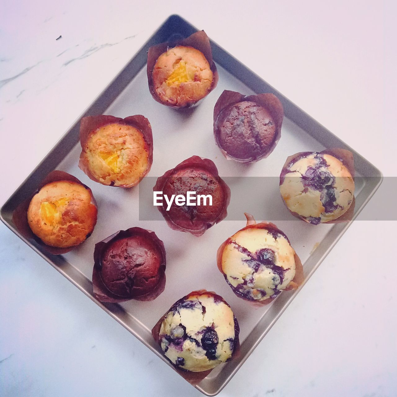 High angle view of muffins in tray on table