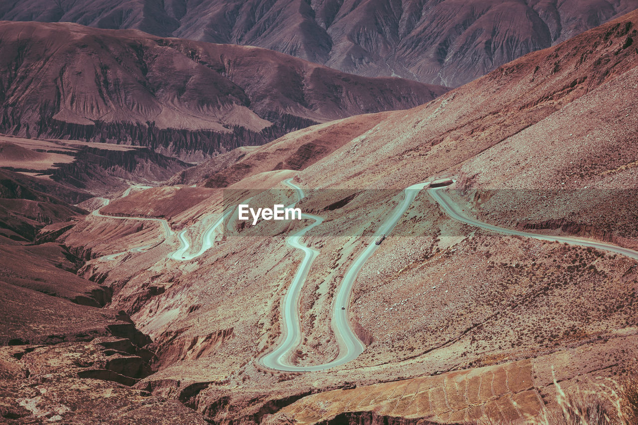 High angle view of road amidst rocky mountains