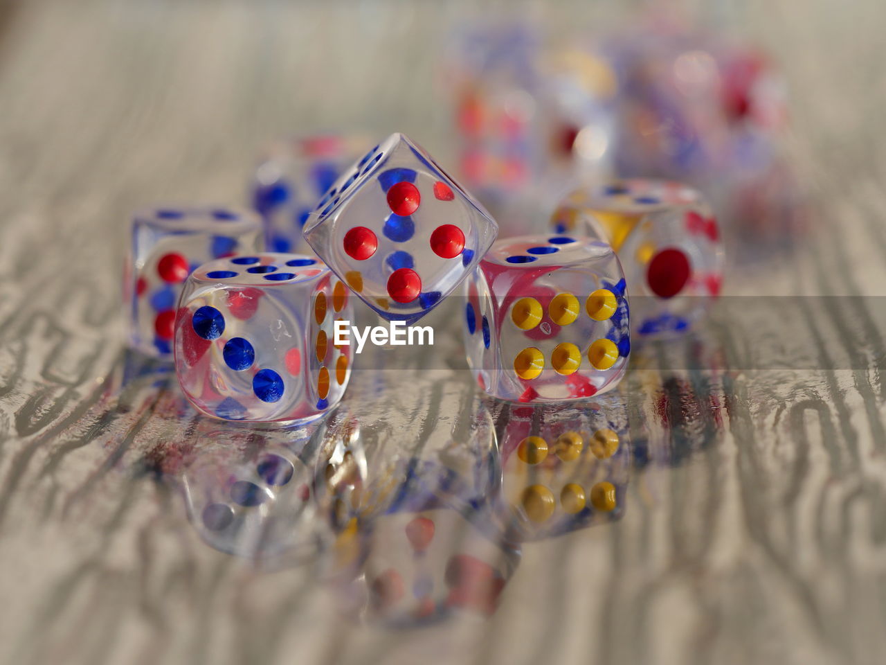 Close-up of multi colored dice on table
