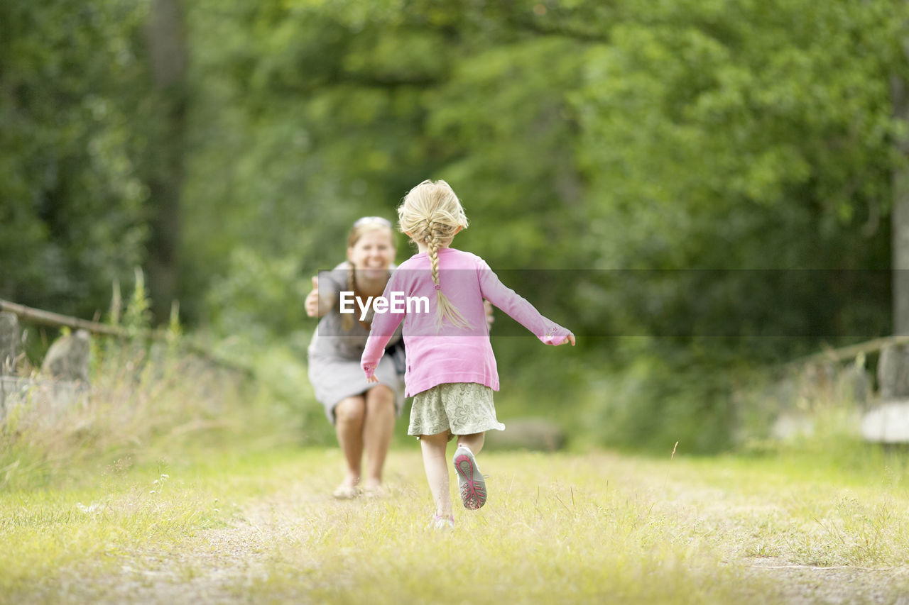 Girl running to her mother