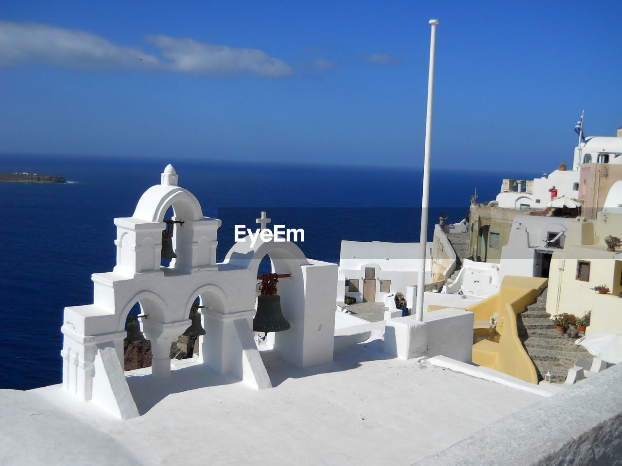 BUILDINGS BY SEA AGAINST SKY