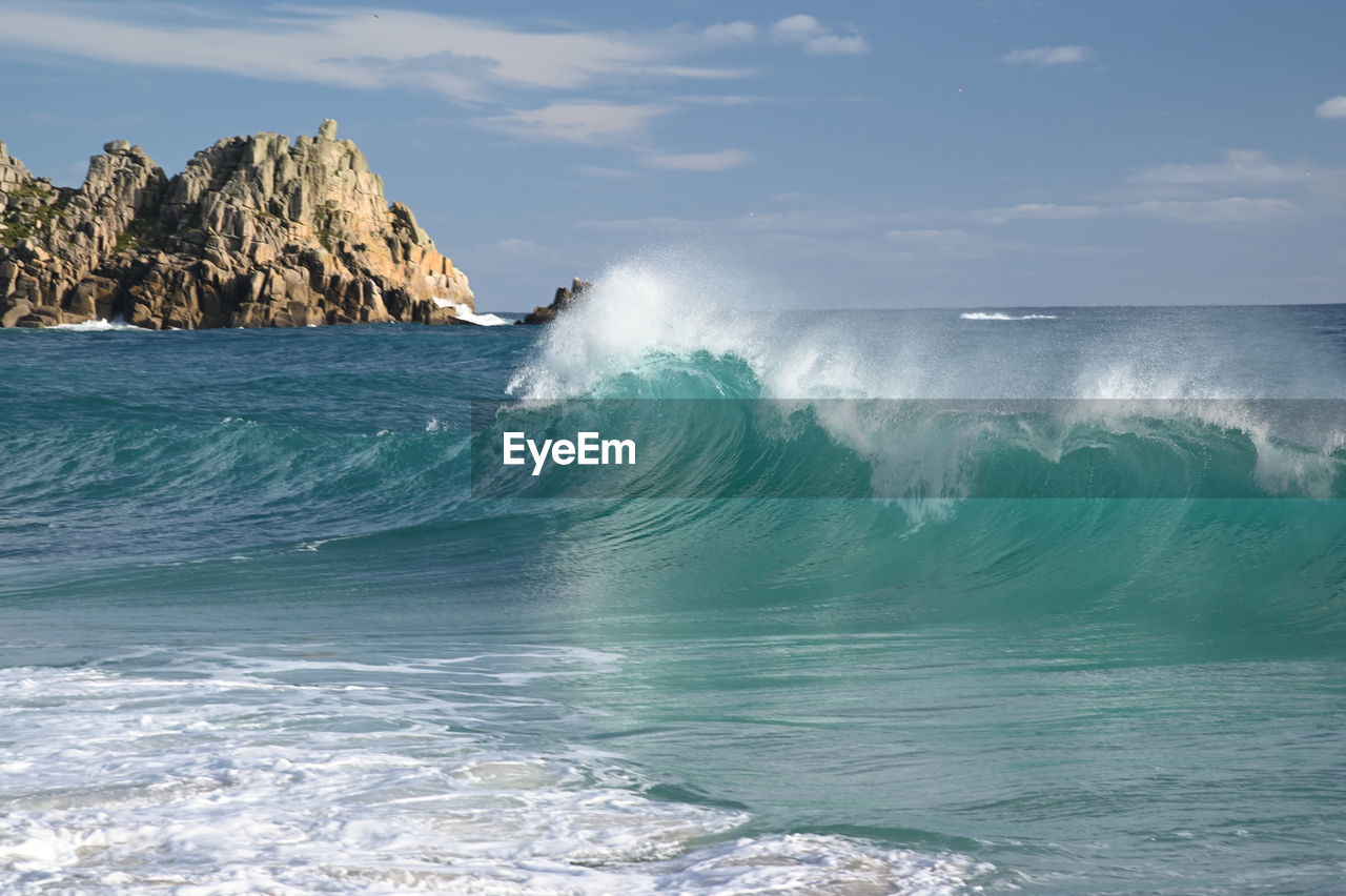 SCENIC VIEW OF SEA WAVES AGAINST SKY