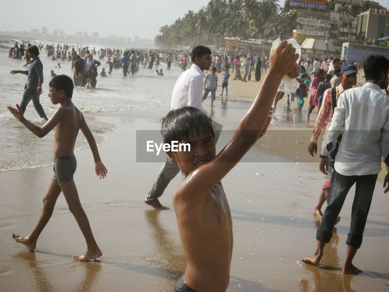 PEOPLE ENJOYING AT BEACH