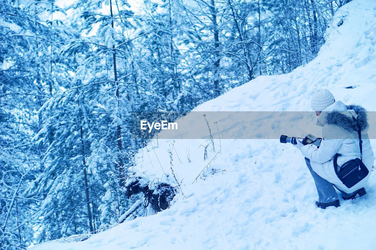 Close-up of photographer in snow