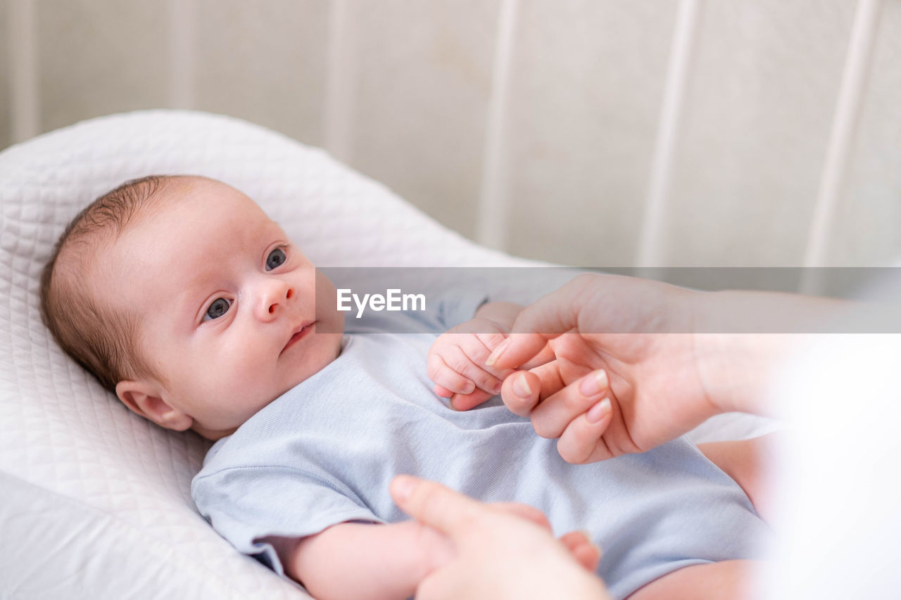 close-up of cute baby boy sleeping on bed