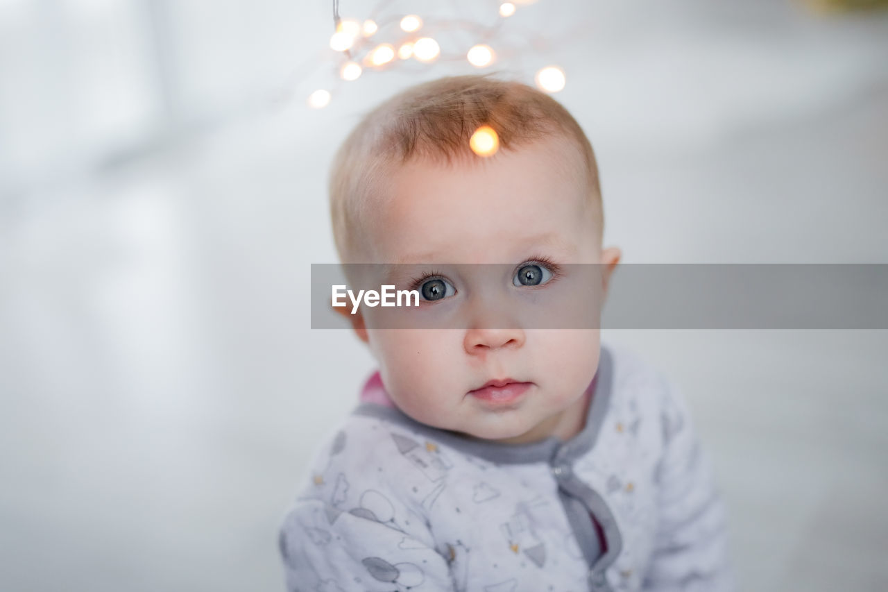 Portrait of cute baby looking at the lights