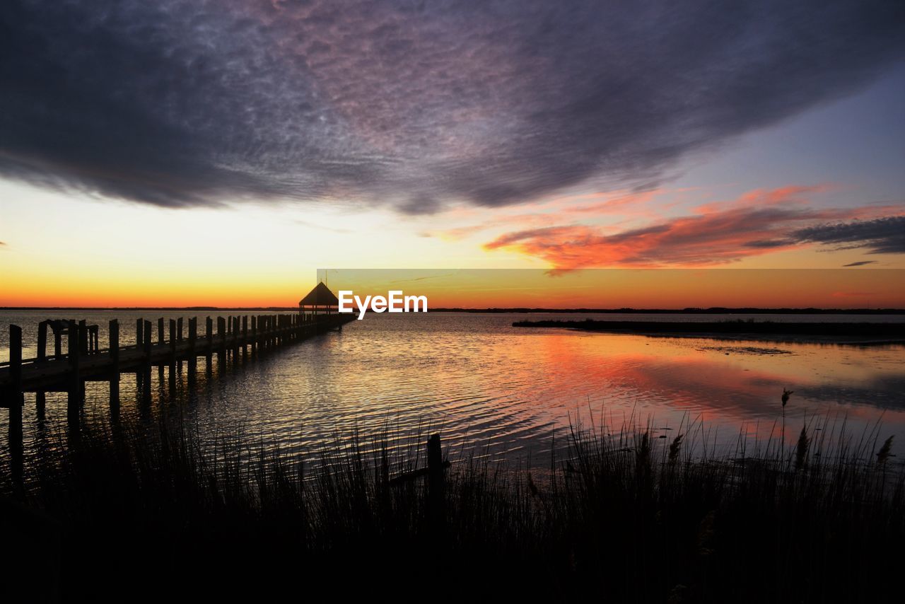 Scenic view of sea against dramatic sky