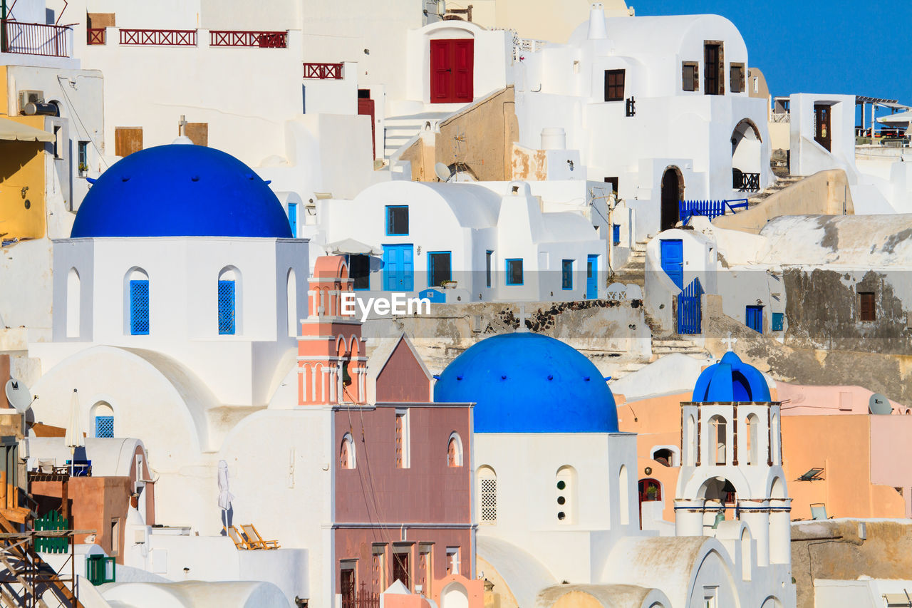 BUILDINGS AGAINST BLUE SKY