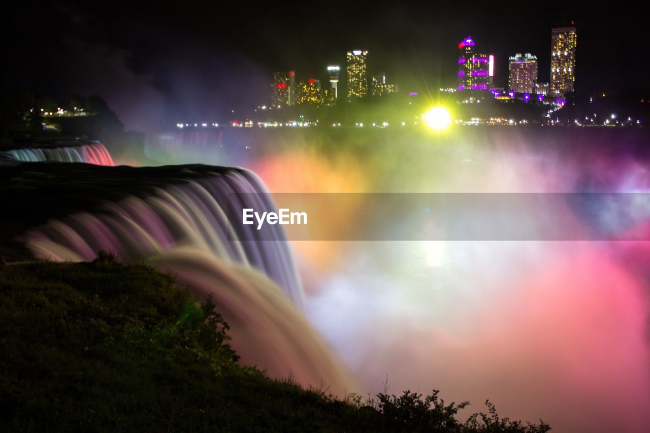 Blurred motion of illuminated niagara falls at night