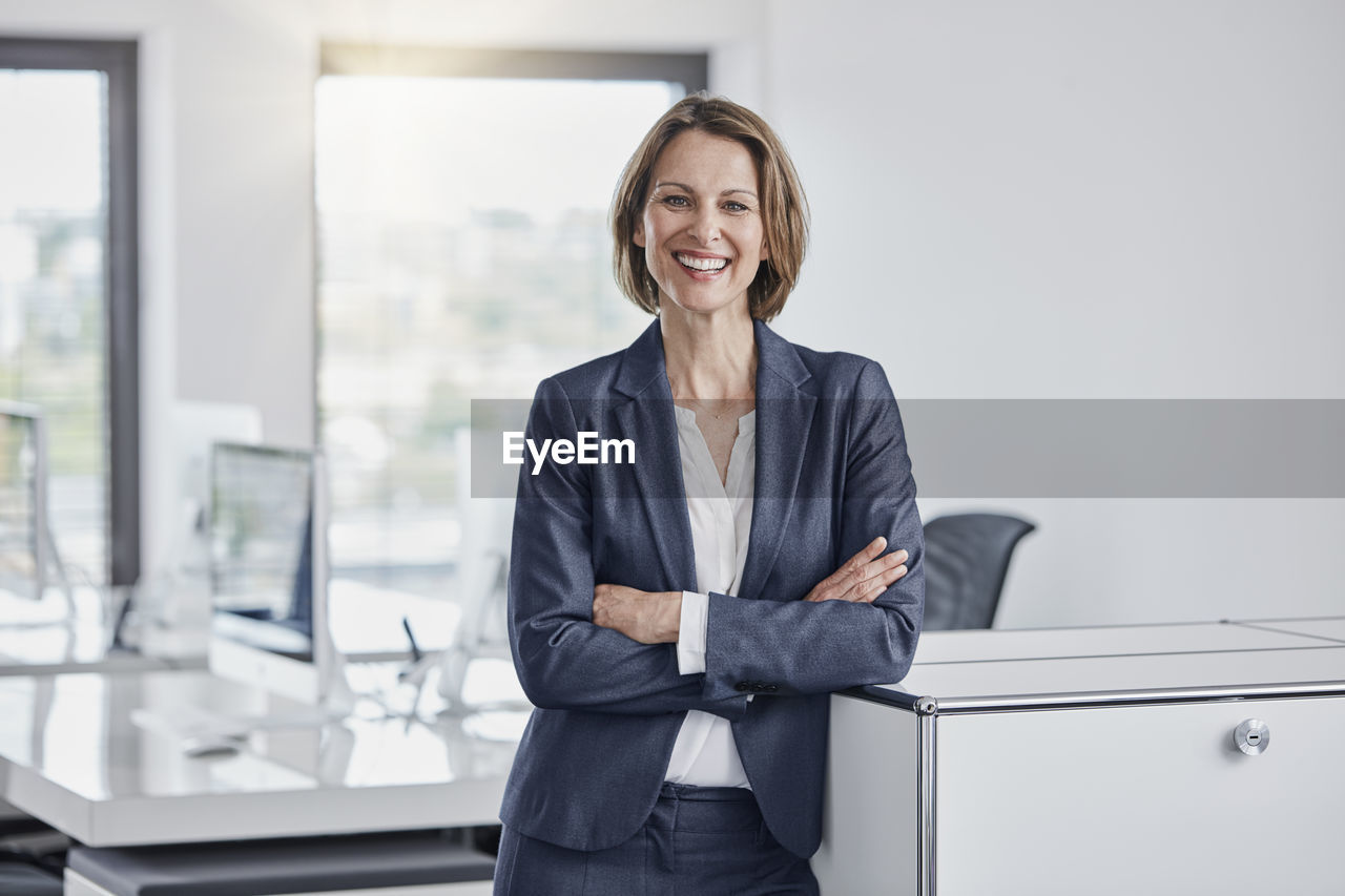 Portrait of happy businesswoman in office