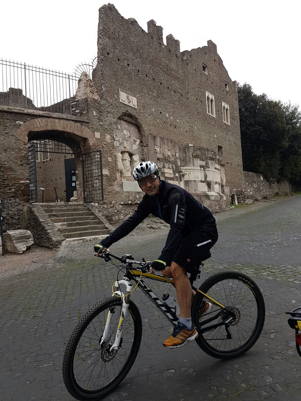 MAN RIDING BICYCLE ON STREET