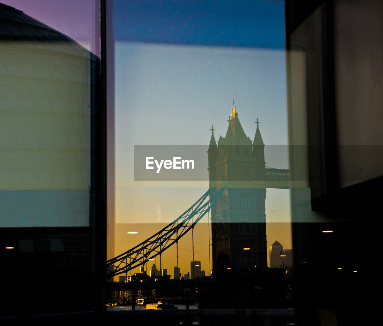 Reflection of tower bridge on glass window