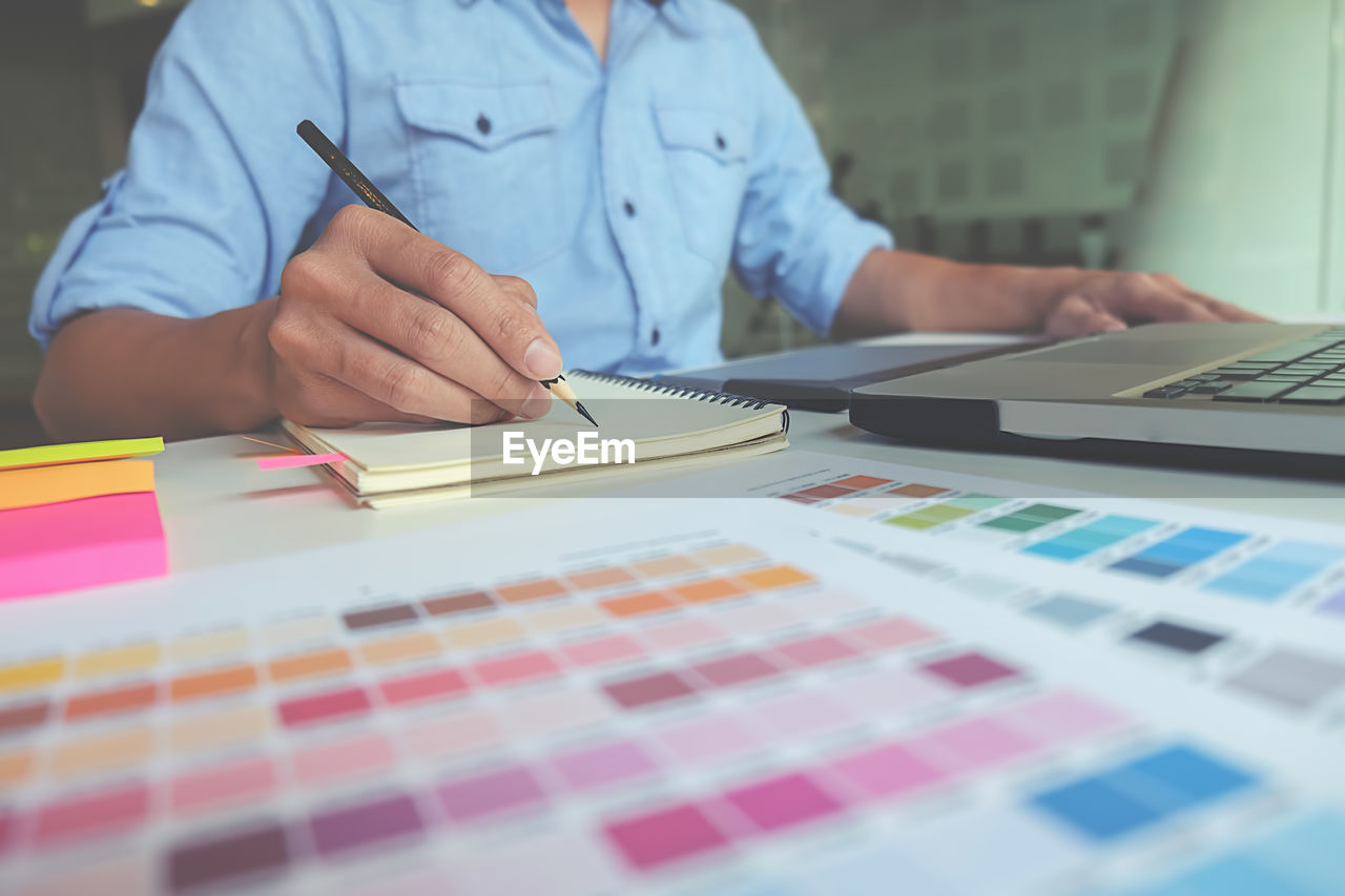 Close-up of man working on table