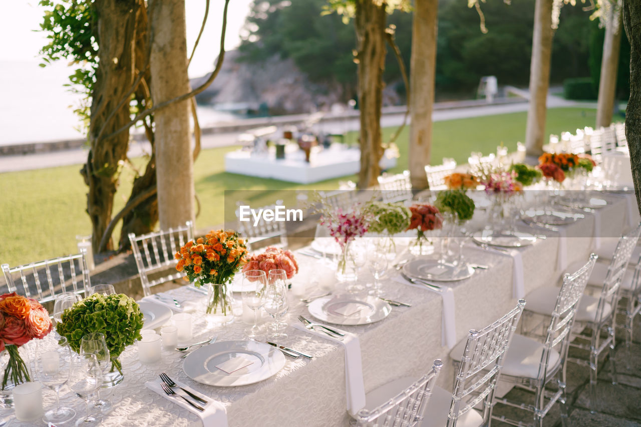 View of decorated place sitting during wedding ceremony