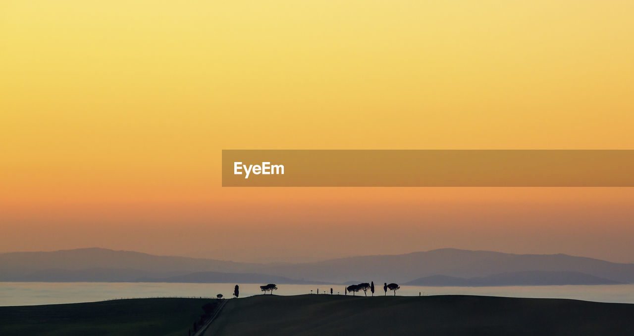 Silhouette mountain against sky during sunset