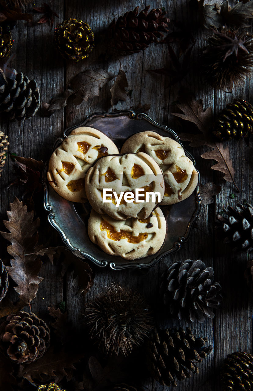 High angle view of halloween cookies in plate on table