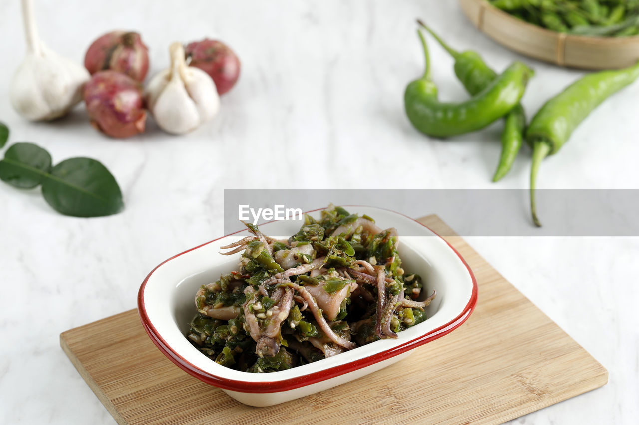Cumi cabai hijau, stir fry squid with green chilli pepper. indonesian popular food menu