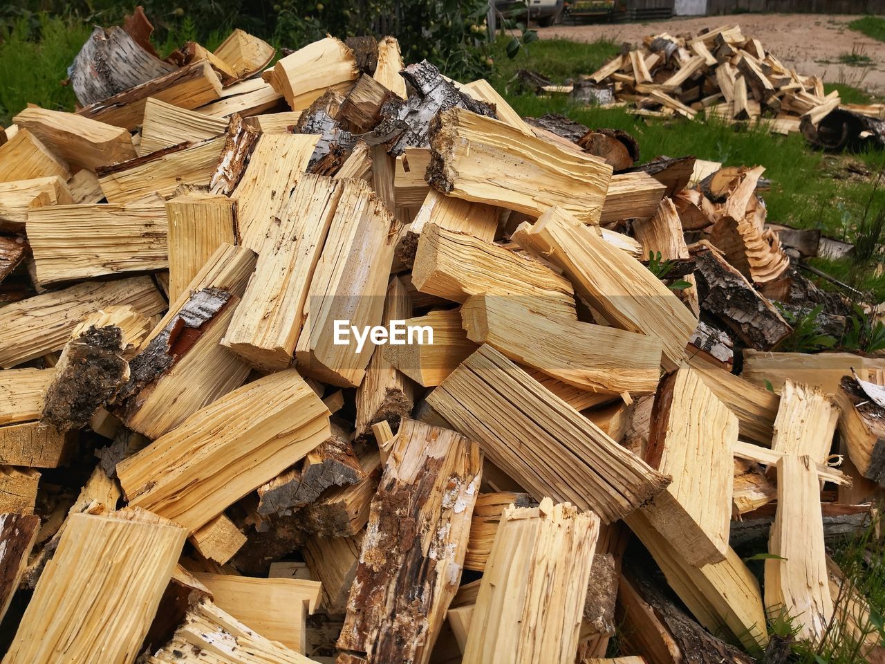 wood, timber, lumber, log, firewood, deforestation, lumber industry, large group of objects, tree, forest, abundance, environmental issues, nature, logging, day, woodpile, no people, plant, heap, field, outdoors, power generation, high angle view, land, environmental damage, brown