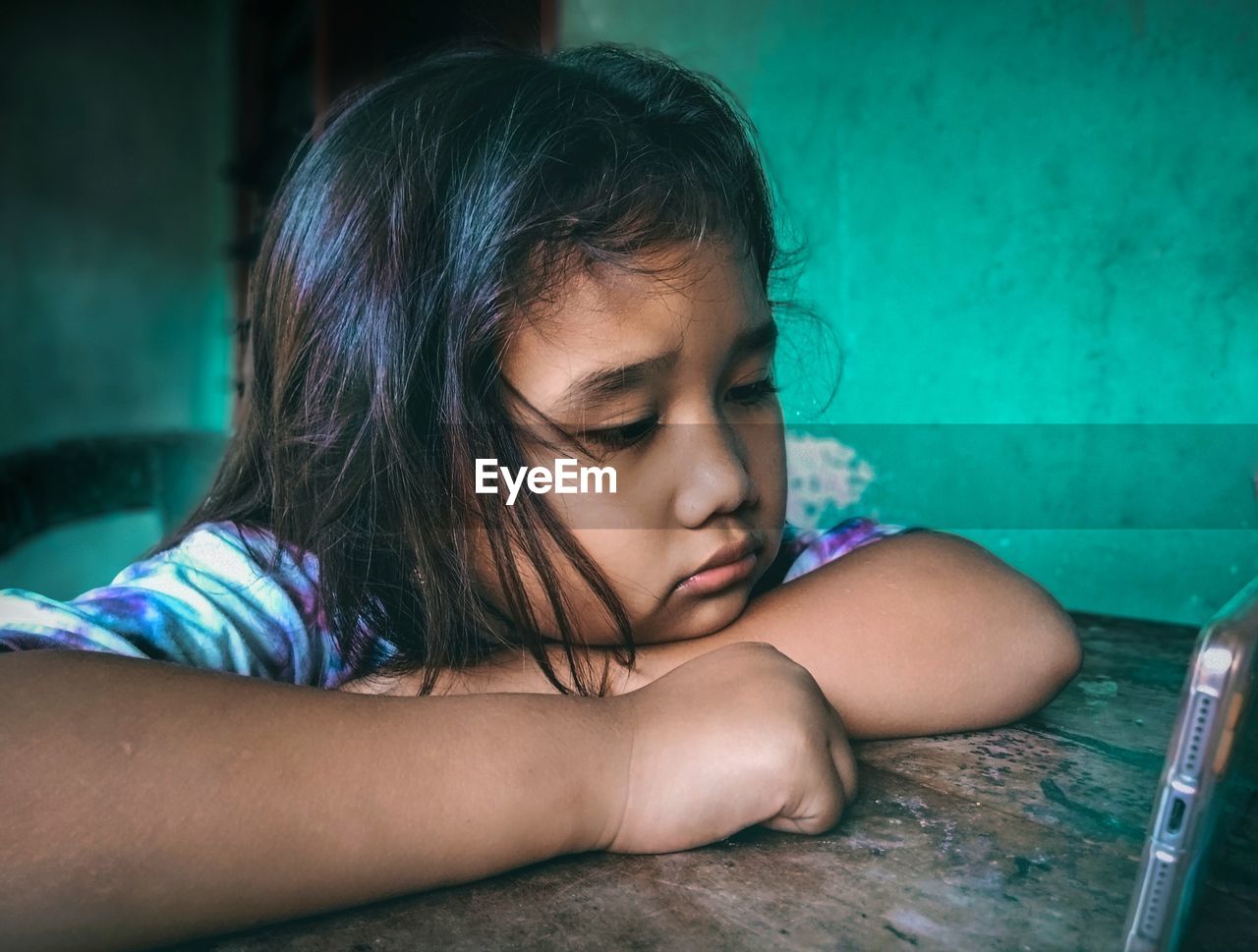 Portrait of a girl looking down