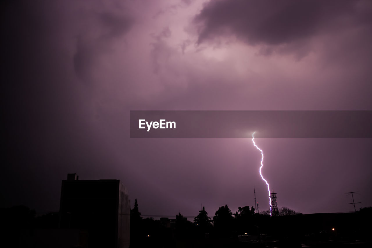 STORM CLOUDS OVER LIGHTNING AT NIGHT