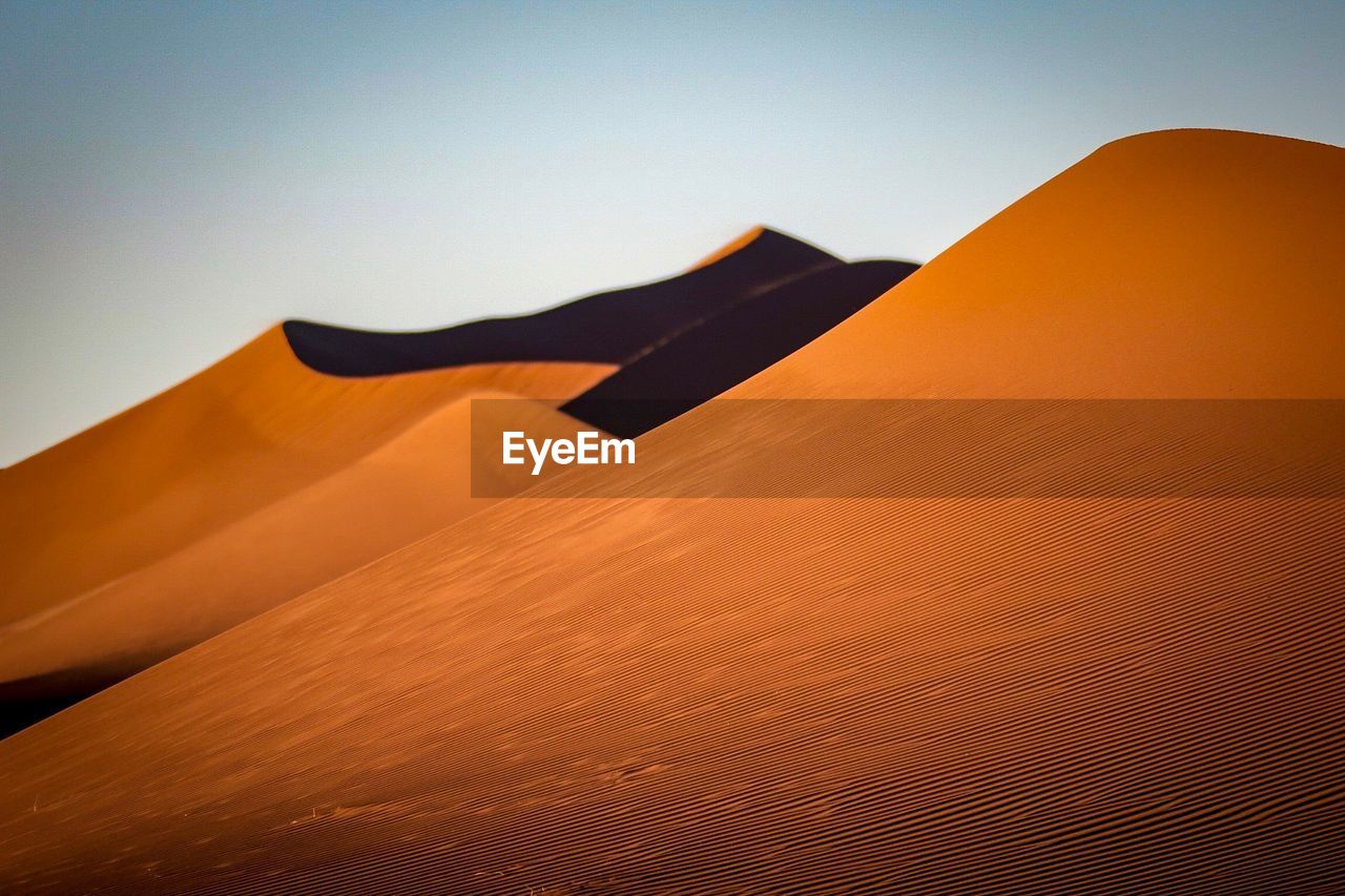 Scenic view of desert against clear sky