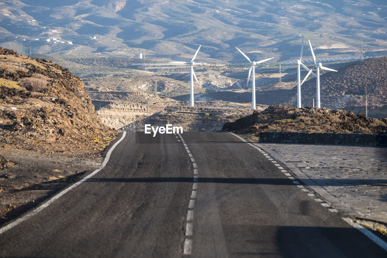 Spain, tenerife, empty road and windpark