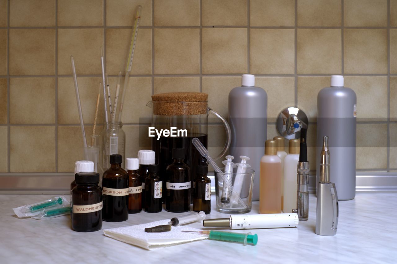 Medical equipment on table against wall at laboratory