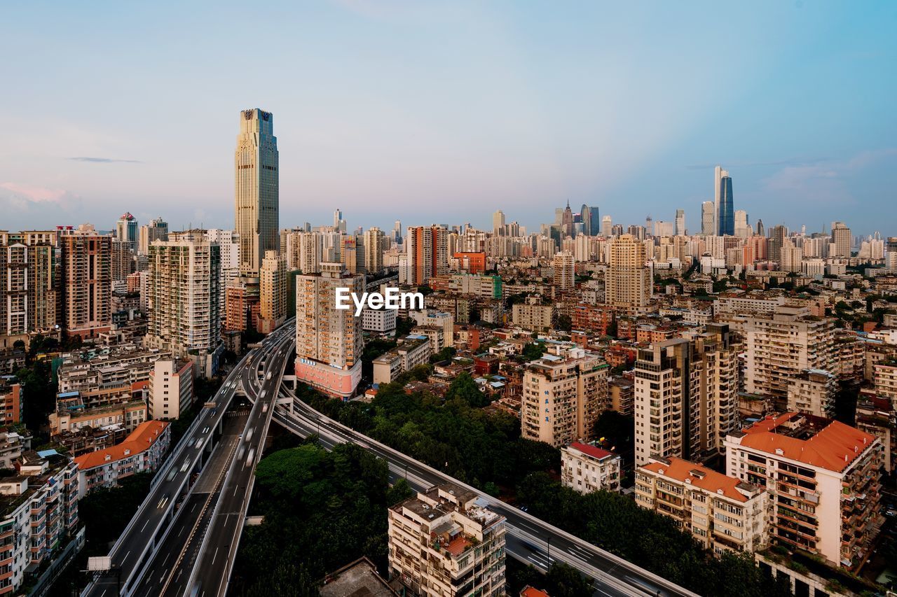 High angle view of buildings in city against sky