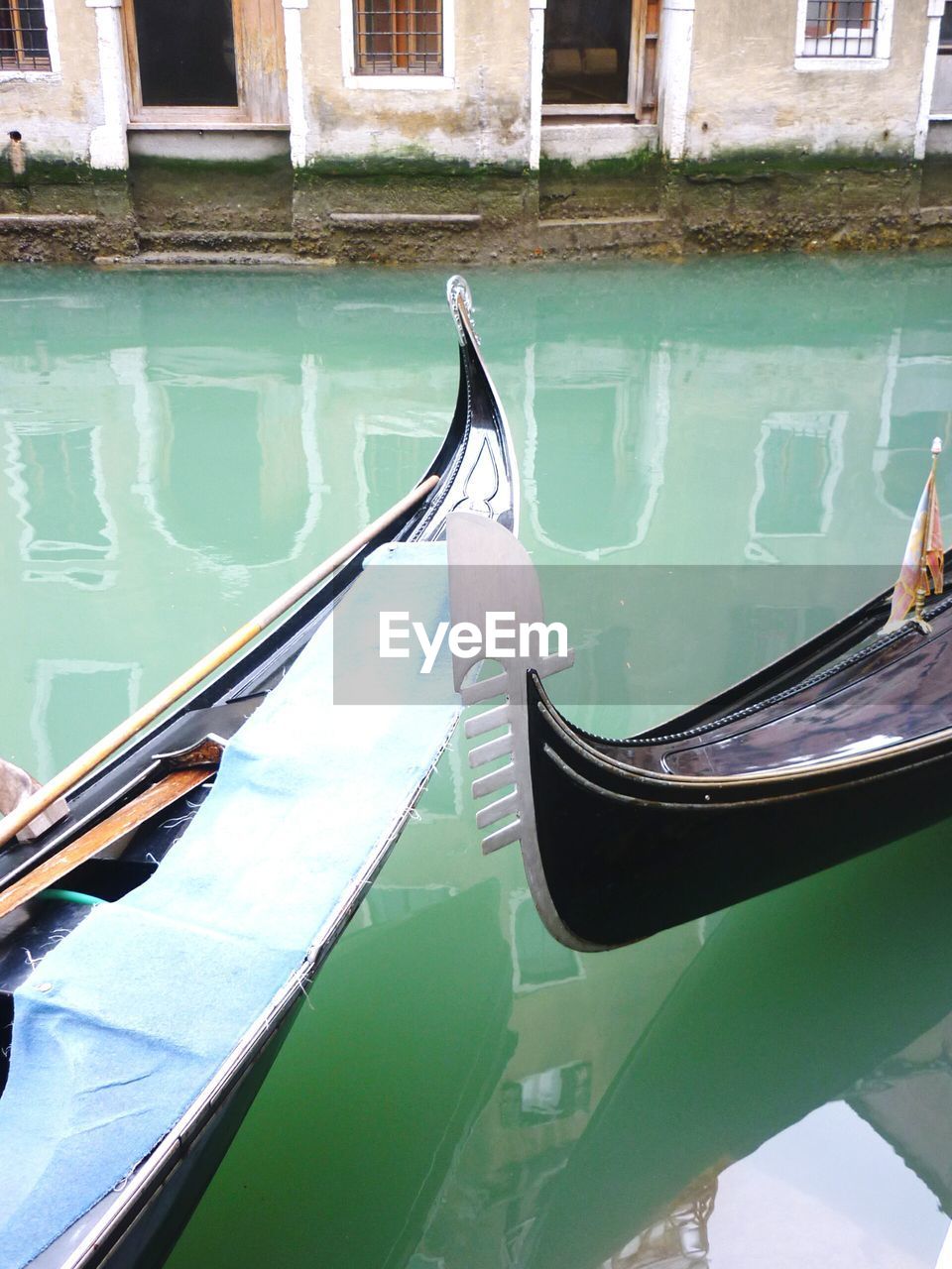 Close-up of gondolas in canal