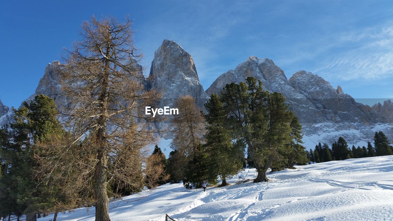 Scenic view of snow covered mountains against sky