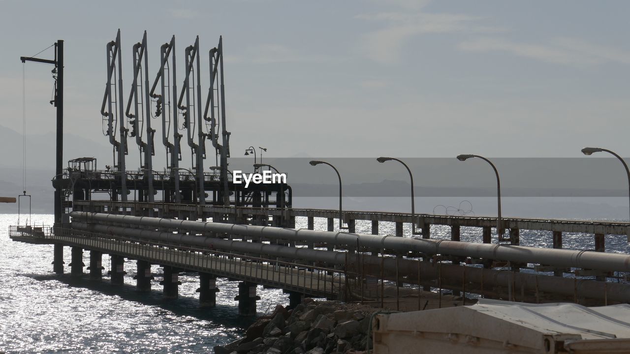 Pier over sea against sky