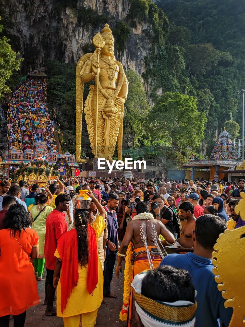 GROUP OF PEOPLE OUTSIDE TEMPLE